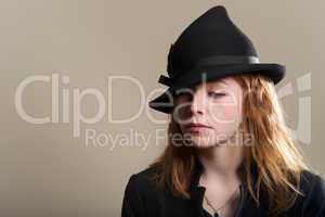 Redhead sad in black hat and jacket