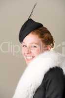 Redhead smiling in black hat and fur