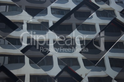 Reflections of skyscraper in mirrored glass building