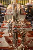 Restaurant table laid with glassware and cutlery