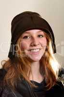Smiling redhead in cloche hat and jacket