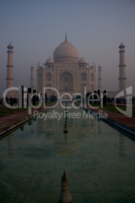 Taj Mahal reflected in water at dawn