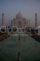 Taj Mahal reflected in water at dawn