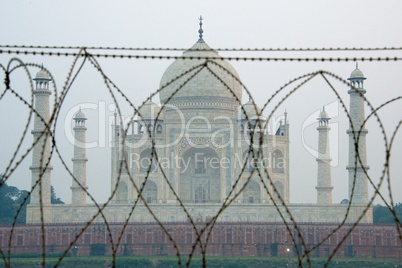 Taj Mahal through barbed wire fence