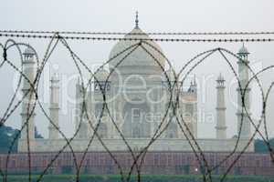 Taj Mahal through barbed wire fence