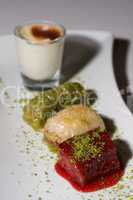 Turkish dessert selection on white china plate