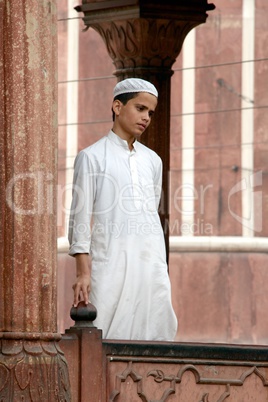 Young boy dressed in white