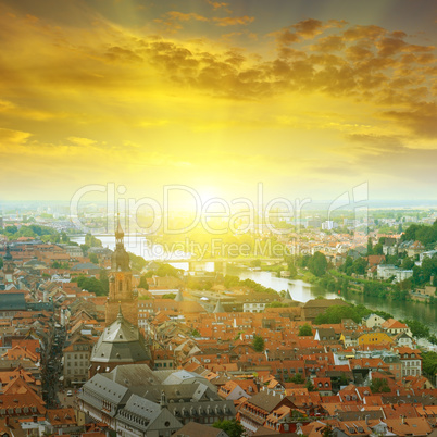city in a mountain valley and sunrise
