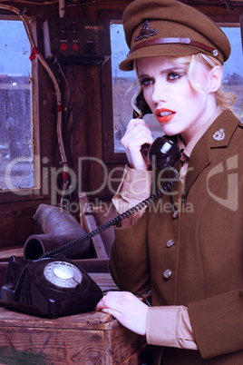 Pretty blond woman in army uniform