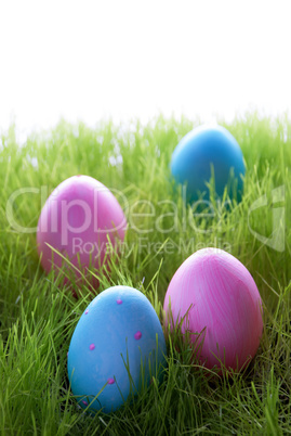 Four Decorative Easter Eggs On Green Grass
