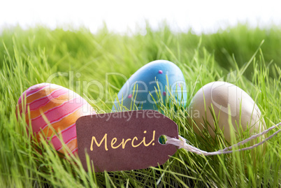 Happy Easter Background With Colorful Eggs And Label With French Text Merci