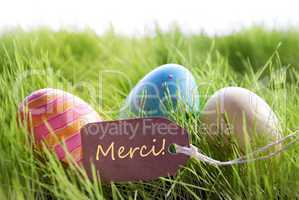 Happy Easter Background With Colorful Eggs And Label With French Text Merci