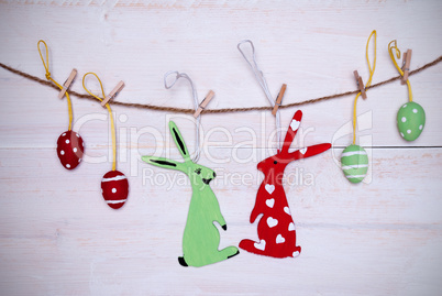 Easter Bunny Couple And Easter Eggs Hanging On Line With Frame