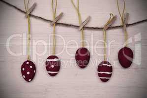Five Red Easter Eggs Hanging On Line With Frame