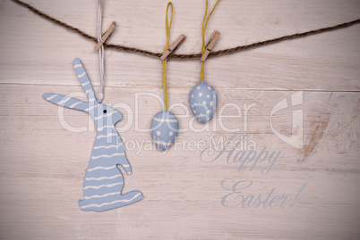 Blue Easter Bunny And Easter Eggs Hanging On Line With Happy Easter