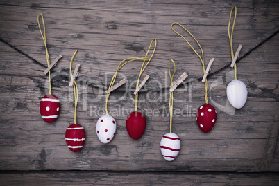 Many Red And White Easter Eggs Hanging On Line  With Frame