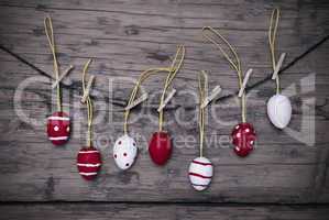Many Red And White Easter Eggs Hanging On Line  With Frame