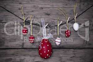 Many Red And White Easter Eggs And One Big Egg Hanging On Line Frame