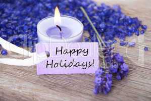 Purple Label With Text Happy Holidays And Lavender Blossoms