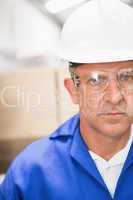 Worker wearing hard hat in warehouse