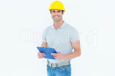 Happy architect holding clip board