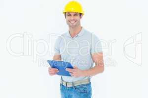 Happy architect holding clip board