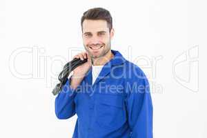 Smiling repairman holding cable