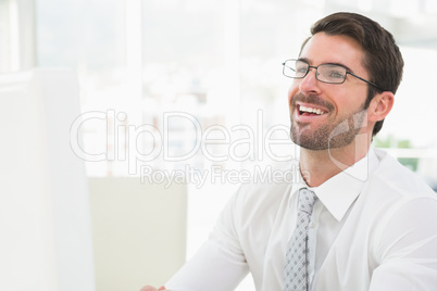 Elegant businessman with glasses laughing