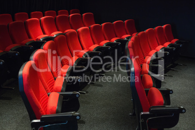 Empty rows of red seats