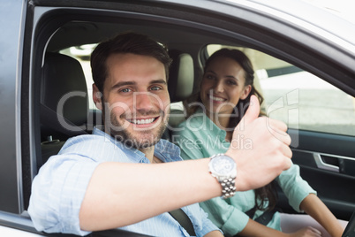 Young couple smiling at the camera