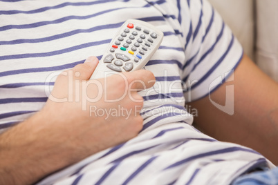 Close up of cute couple watching tv on the couch