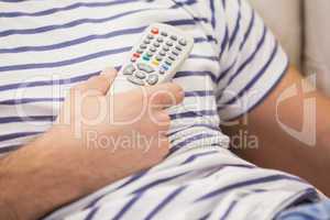 Close up of cute couple watching tv on the couch