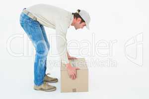 Delivery man picking cardboard box