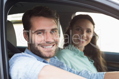 Young couple smiling at the camera