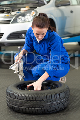 Mechanic working on a tire wheel