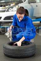 Mechanic working on a tire wheel