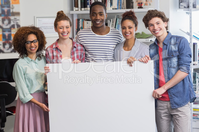 Fashion students smiling at camera together