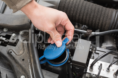 Man checking the engine of his car