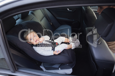Cute baby in a car seat