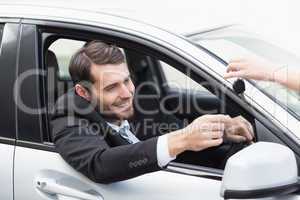 Businessman sitting in drivers seat