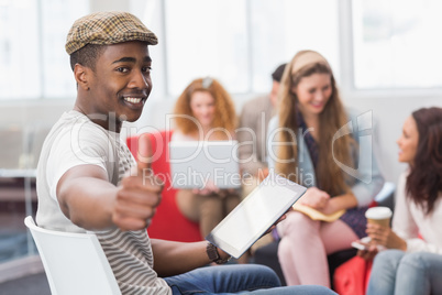 Fashion student using tablet pc