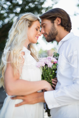 Attractive couple about to kiss each other