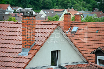Tile roof with a chimney