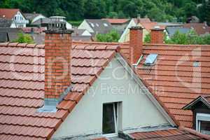 Tile roof with a chimney