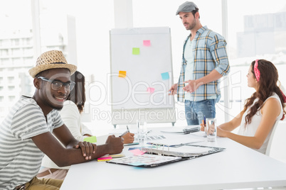 Businessman presenting and colleagues listening