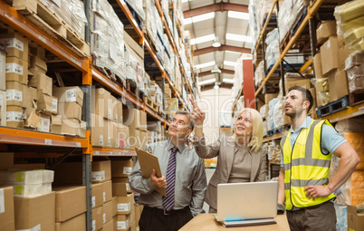 Cheerful warehouse team working together