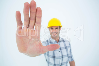 Carpenter showing palm over white background