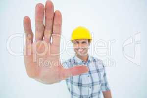 Carpenter showing palm over white background