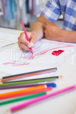 College student drawing picture with colored pencil
