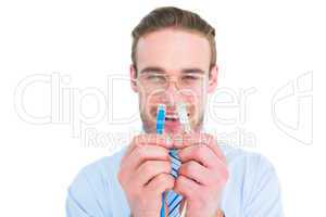 Geeky businessman holding two cables